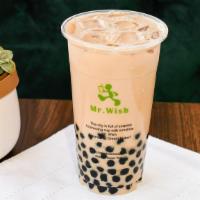 Wow! Pearl Milk Tea · Brewed black tea mixed with our non-dairy milk and of course our famous bubbles!