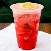 Strawberry Green Tea · Our brewed green tea blended with whole strawberries and a hint of fresh squeezed lemon