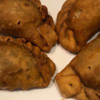 Chicken Empanada · Dairy-free. Fried Flour Turnover filled with Shredded Chicken, Potato, minced Onions, Cilant...