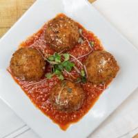 Arancini  · Fried rice balls coated with breadcrumbs, stuffed with ground beef peas & mozzarella; with t...