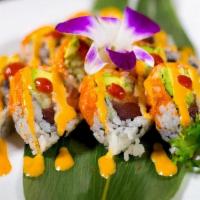 Volcano Roll · Yellow fin tuna, Alaska salmon, avocado and cucumber inside, with caviar and two kinds of sp...