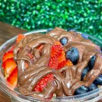 Nutella Acai Bowl · Base: organic acai juice, organic acai berries, banana  toppings: seasonal berries, nutella,...