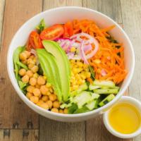 Vegan Cobb Salad · Spring mix, chickpeas, grape tomatoes, cucumber, carrots, corn, red onion, avocado, dijon mu...