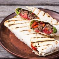 Philly Cheesesteak Wrap · Philly steak, bell peppers, mozzarella cheese, portabella mushroom, caramelized onion.