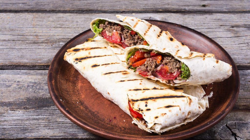 Philly Cheesesteak Wrap · Philly steak, bell peppers, mozzarella cheese, portabella mushroom, caramelized onion.