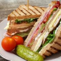 Turkey Club Sandwich · Roasted turkey breast, monterey jack cheese tomato, leaf lettuce, mayonnaise.