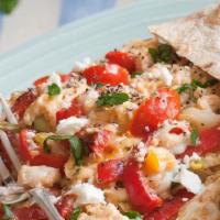 Greek Breakfast Wrap (Mediterranean Wrap) · Eggs, tomatoes, red onions, Kalamata olives and feta cheese.