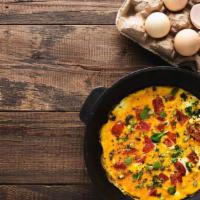 Veggie Omelette · 2 scrambled eggs, bell peppers, onion, broccoli, mushroom, tomatoes.