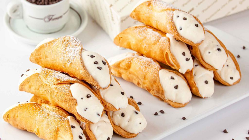 Cannolo Siciliano · Crispy shell, sweet ricotta cream & chocolate chips

*Contains eggs, dairy, wheat, soy 
*Produced in a facility where nuts, milk, eggs, soy & wheat are present