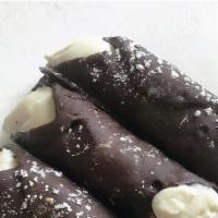 Chocolate Cannolo · Crispy hand dipped chocolate shell, sweet ricotta cream & chocolate chips

*Contains eggs, d...