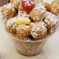 Struffoli Cup · Baked honey dough balls, topped with nonpareils

*Contains eggs, wheat, soy 
*Produced in a ...