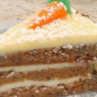 Carrot Cake Slice · Moist & rich with carrots, bananas, nuts-topped & layered with our traditional cream cheese ...