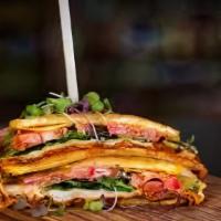 Toston Burger · Angus beef, swiss cheese, bacon, pico de gallo, avocado, and chipotle mayonnaise on Plantain...