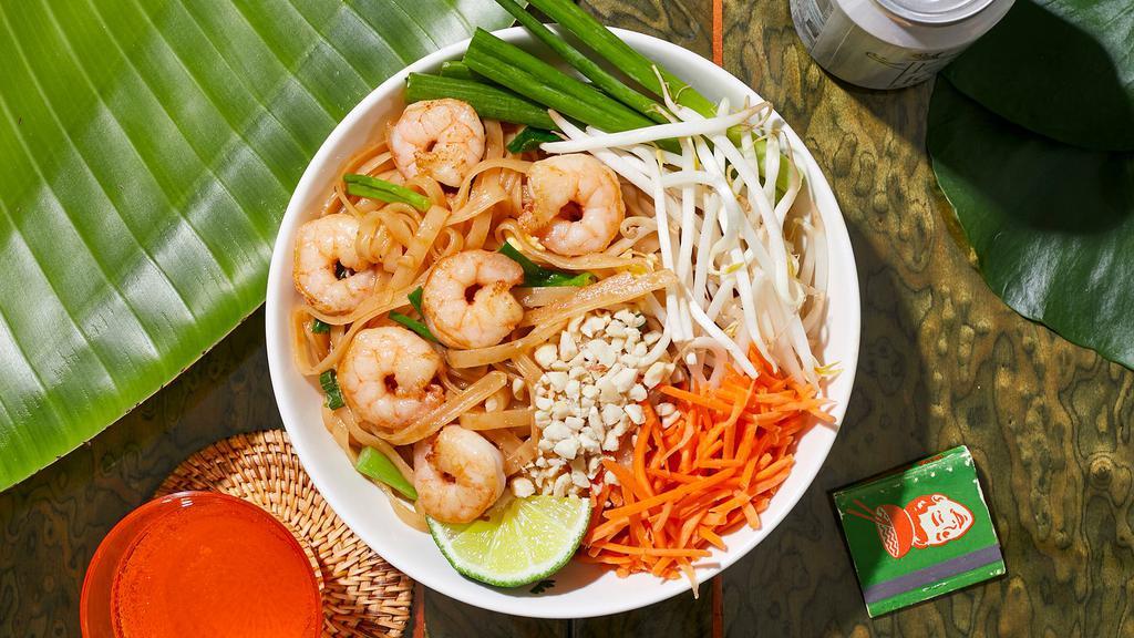 Shrimp Pad Thai · Stir-fried rice noodles with shrimp, scallions, bean sprouts, scrambled egg, and crushed peanuts.