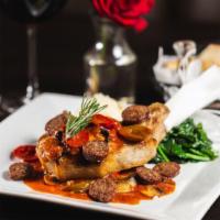 Leindy’S Double Cut Pork Chop · Sauteed onions, hot cherry peppers, mushroom, Italian sausage, a touch of tomato sauce and m...