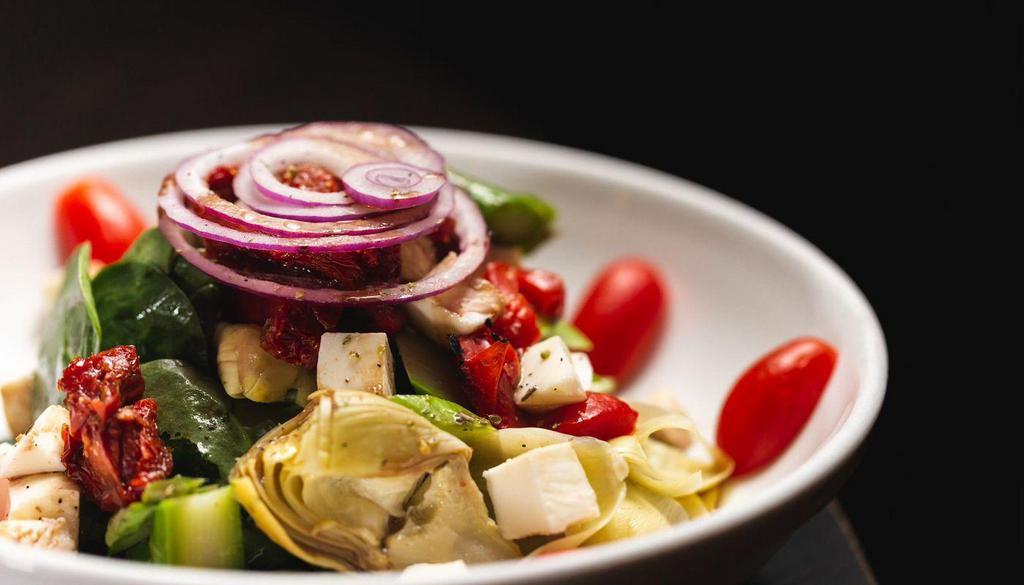 Artichoke And Asparagus Salad · Sun-dried tomatoes, red onions, roasted peppers, mozzarella cheese and Romaine.
