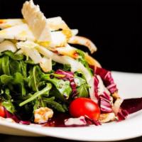 Nonna Salad · Arugula, endive, plum tomatoes, red onions, extra virgin olive oil and balsamic glaze.