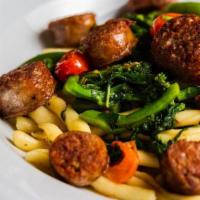 Homemade Fusilli And Sausage · Served with broccoli rabe, extra-virgin olive oil and cherry tomato.