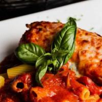 Chicken Toscana · Stuffed with mozzarella cheese, ricotta cheese, spinach, light tomato sauce and rigatoni.