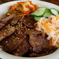 Galbi (Short Rib) Bowl · Grilled Soy-marinated Short Rib on a bed of lettuce and white rice, served with kimchi, daik...