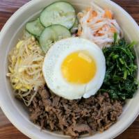 Bibimbap · The Korean Tradition at its best! 
a bowl of white rice with a protein of your choice, daiko...