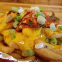 K-Town Fries · Topped with pan-fried kimchi, melted cheese, and scallion