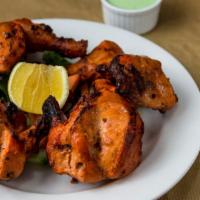 Grilled Tandoori Chicken · Young whole chicken marinated overnight and grilled in a traditional tandoor to perfection. ...