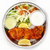 Fish Tikka · Salmon marinated overnight and grilled in a tandoor.