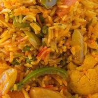 Vegetable Biryani · Aromatic rice dish made by cooking basmati rice with mix veggies, herbs, and biryani spices.