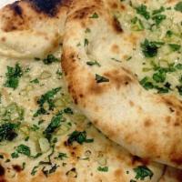 Garlic Naan · Tandoor-baked flatbread seasoned with garlic.