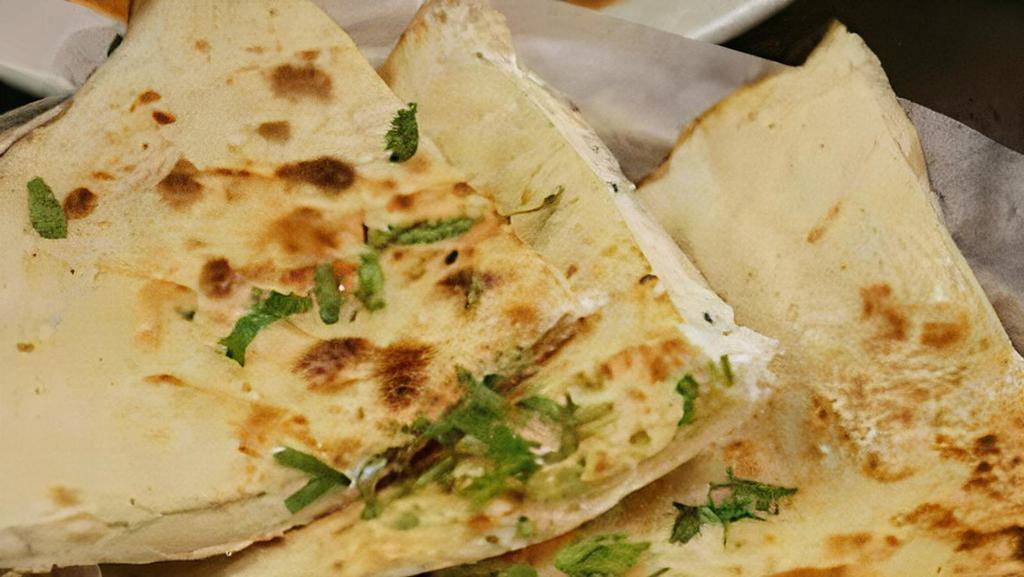Cheese Naan · Tandoor-baked flatbread topped with cheese.