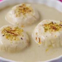 Rasmalai · Cottage cheese cake with out the crust, sweetened cream, and pistachio flavored.