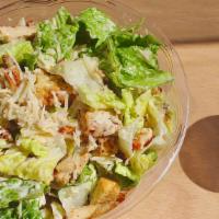 Grilled Chicken Caesar Salad · Romaine, grilled chicken, croutons, shaved parmesan and Caesar dressing.