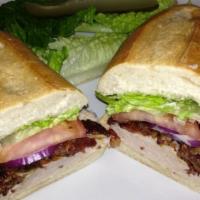 Turkey Club Sandwich · Turkey, cheddar cheese, bacon, lettuce, tomatoes and mayonnaise.