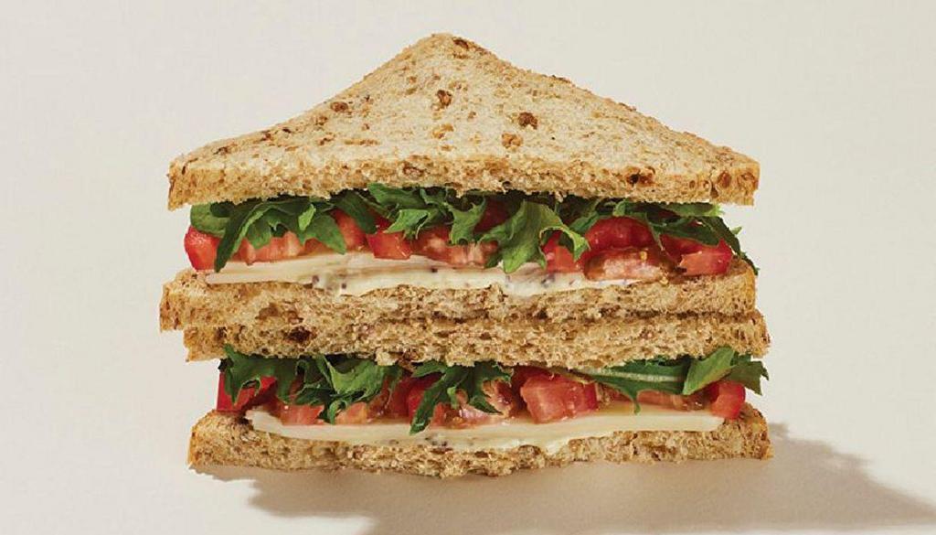 Cheddar & Tomato Sandwich · Sliced Wisconsin Cheddar topped with tomatoes, mesclun, and a dash of whole grain mustard mayo, served on multi-grain bread.