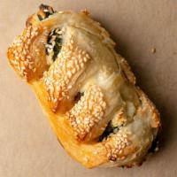 Spinach Burekas · Puff pastry dough filled with sautéed spinach, feta cheese and sour cream