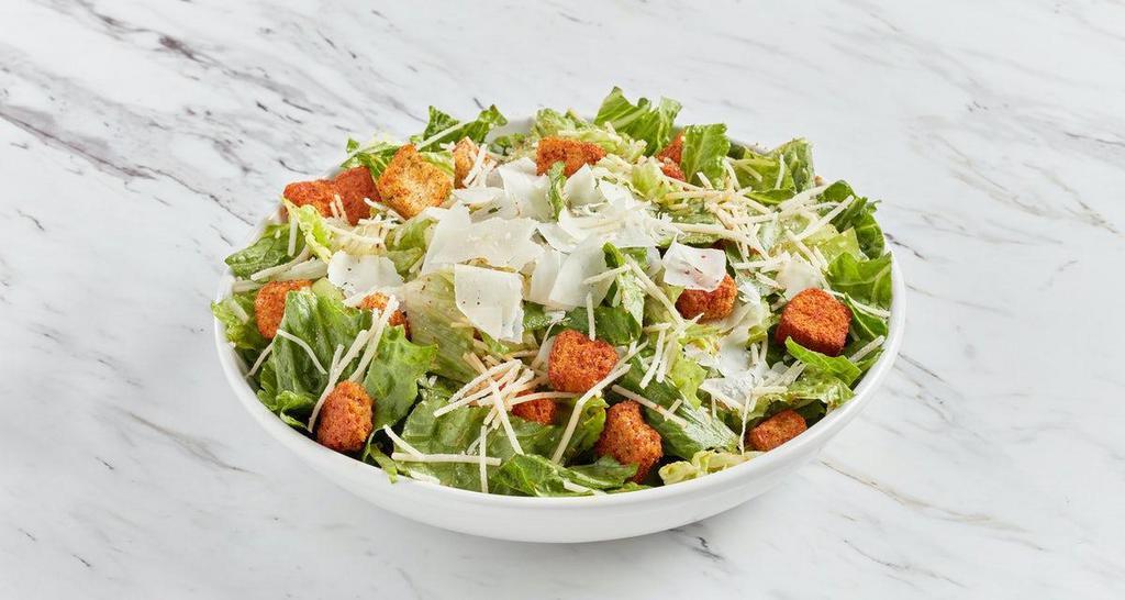 Caesar Salad · Crispy romaine lettuce topped with shaved parmesan and chili-dusted croutons, house-made Caesar dressing