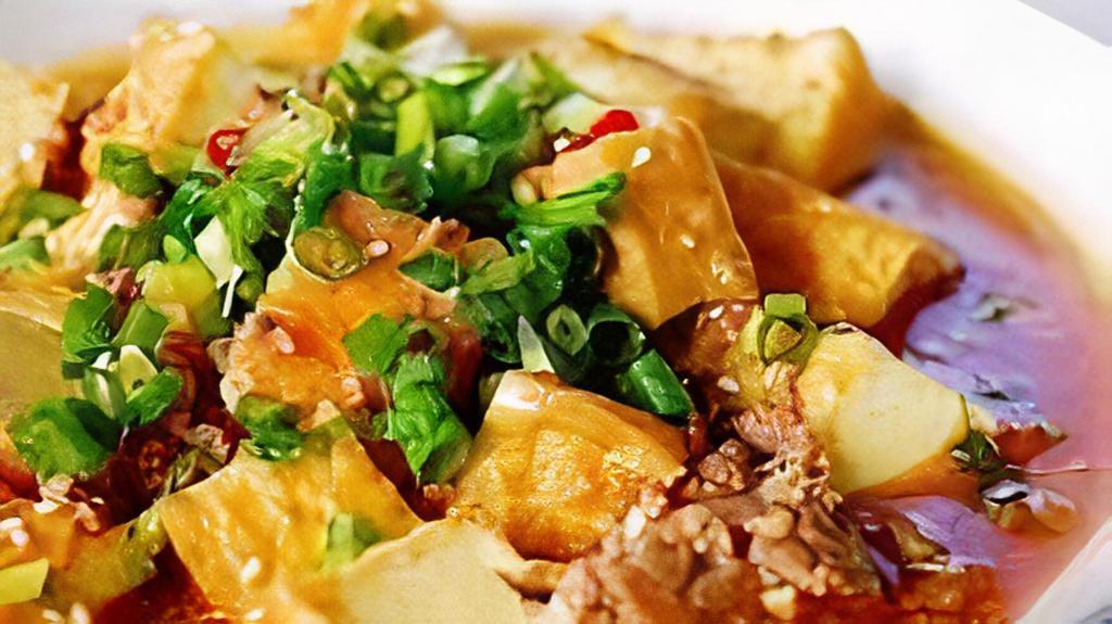 Ma-Po Tofu · world favorite, pieces of silken tofu marinated in brown sauce with green onion.