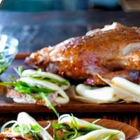 Peking Duck (Half Or Whole) · our #1 signature dish, served with 6 fluffy white buns lined with green onion and hoisin sau...