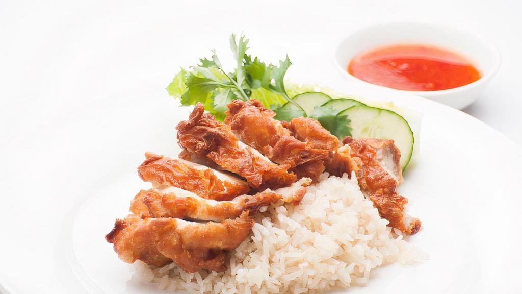Crispy Fried Chicken Bowl · (GAI-TODD) Crispy boneless chicken thigh with ginger rice, lettuce, tomato, cucumber & a side of Sweet chili sauce