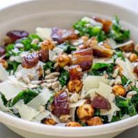 Dressed Kale Salad · Curly kale, medjool dates, parmesan flakes, spiced chickpeas, sunflower seeds, dressed in ch...