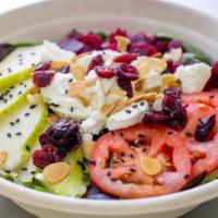 Goat Cheese Salad · Fresh mixed greens, tomatoes, fresh pears, dried cranberries, beets, black sesame seeds, roa...