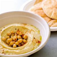 Hummus Bowl · Home Made hummus, with two fresh pitas. Pick A Topping: plain / chopped salad and egg / chic...