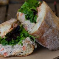 Crunchy Tuna Sandwich · Tuna mixed with Mediterranean pickles, corn, chopped carrots, mayonnaise, fresh greens, and ...
