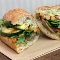 Rustic Vegan Sandwich · Marinated shiitake, grilled zucchini, spiced chickpeas, fresh greens, tomatoes, and dressed ...