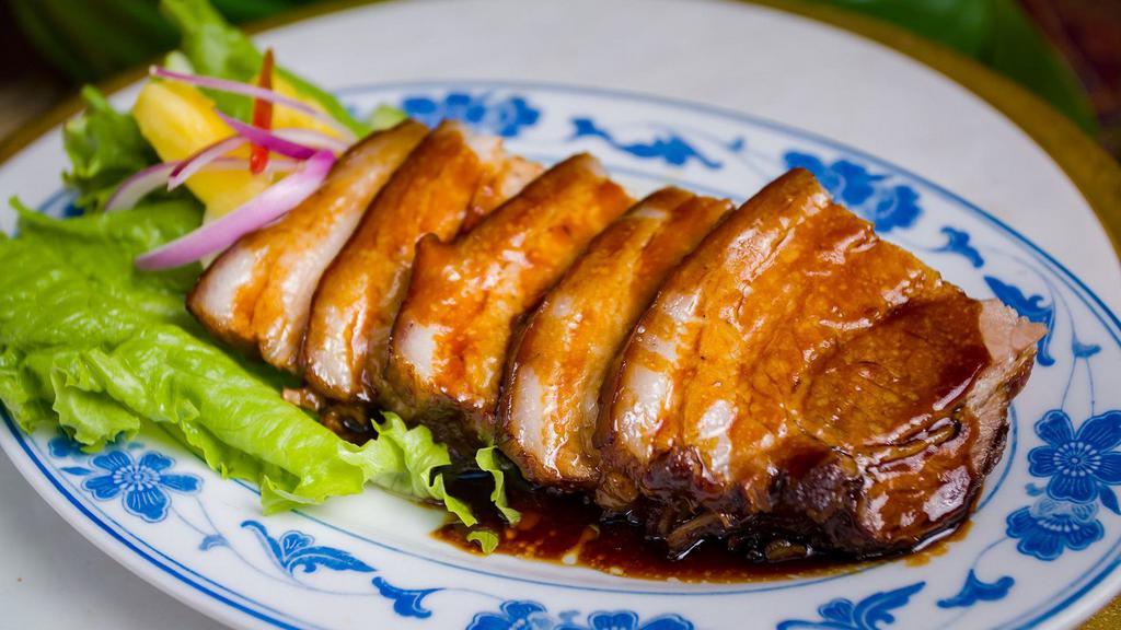 Tau Yu Bak / Soy Sauce Braised Pork Belly · Not spicy. Pork belly in intensely flavorful soy sauce. Served with choice of jasmine rice or mantou. No substitution. Contains pickles (cucumber, carrot, cabbage).