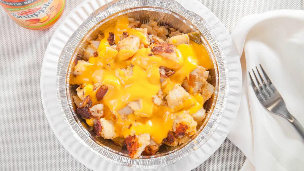 Home Fries With Cheese · Freshly made Potatoes mixed with onions and peppers and seasoned to perfection topped with melted nacho cheese.