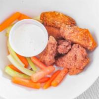 Buffalo Wings · Includes blue cheese dressing with celery and carrot sticks.