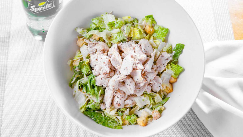 Chicken Caesar Salad · Romaine lettuce, croutons, parmesan cheese with grilled chicken and caesar dressing.