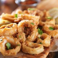 Fried Calamari · Tender rings of calamari lightly battered and fried until just tender.